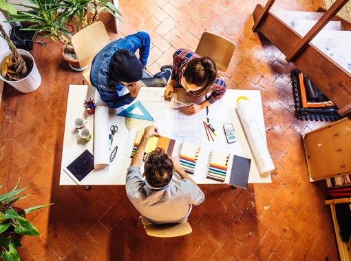 People working around table