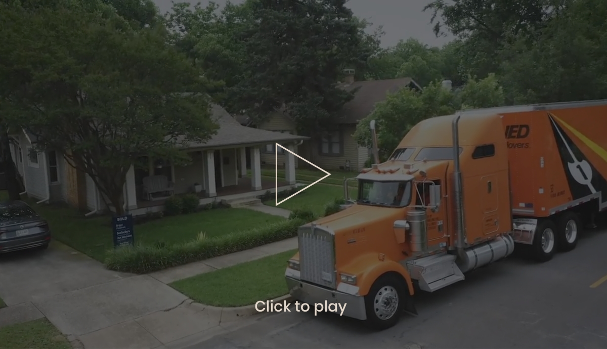 Allied Van Lines truck parked in front of home.