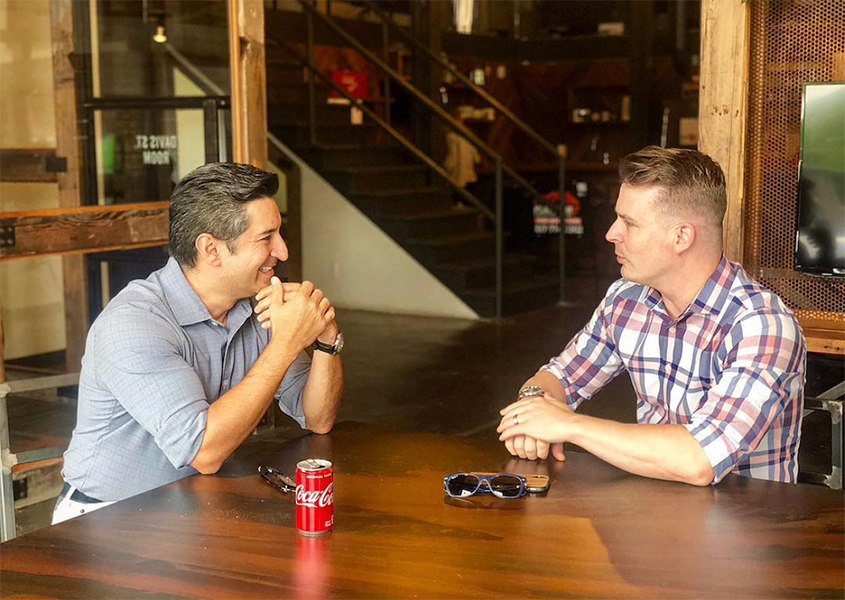 Manny Valencia speaking with Ryan Wheat, Founder of Leather Union