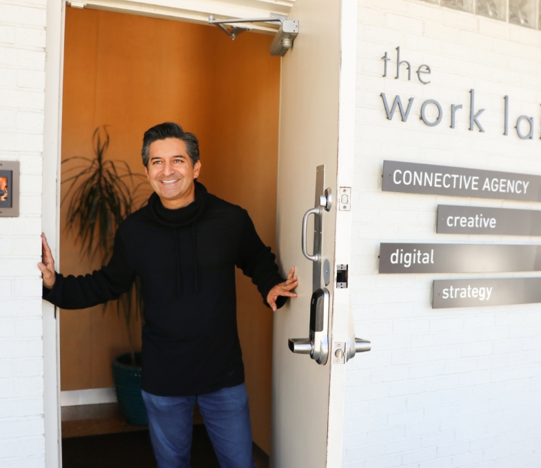 Connective Agency Owner smiling and greeting.