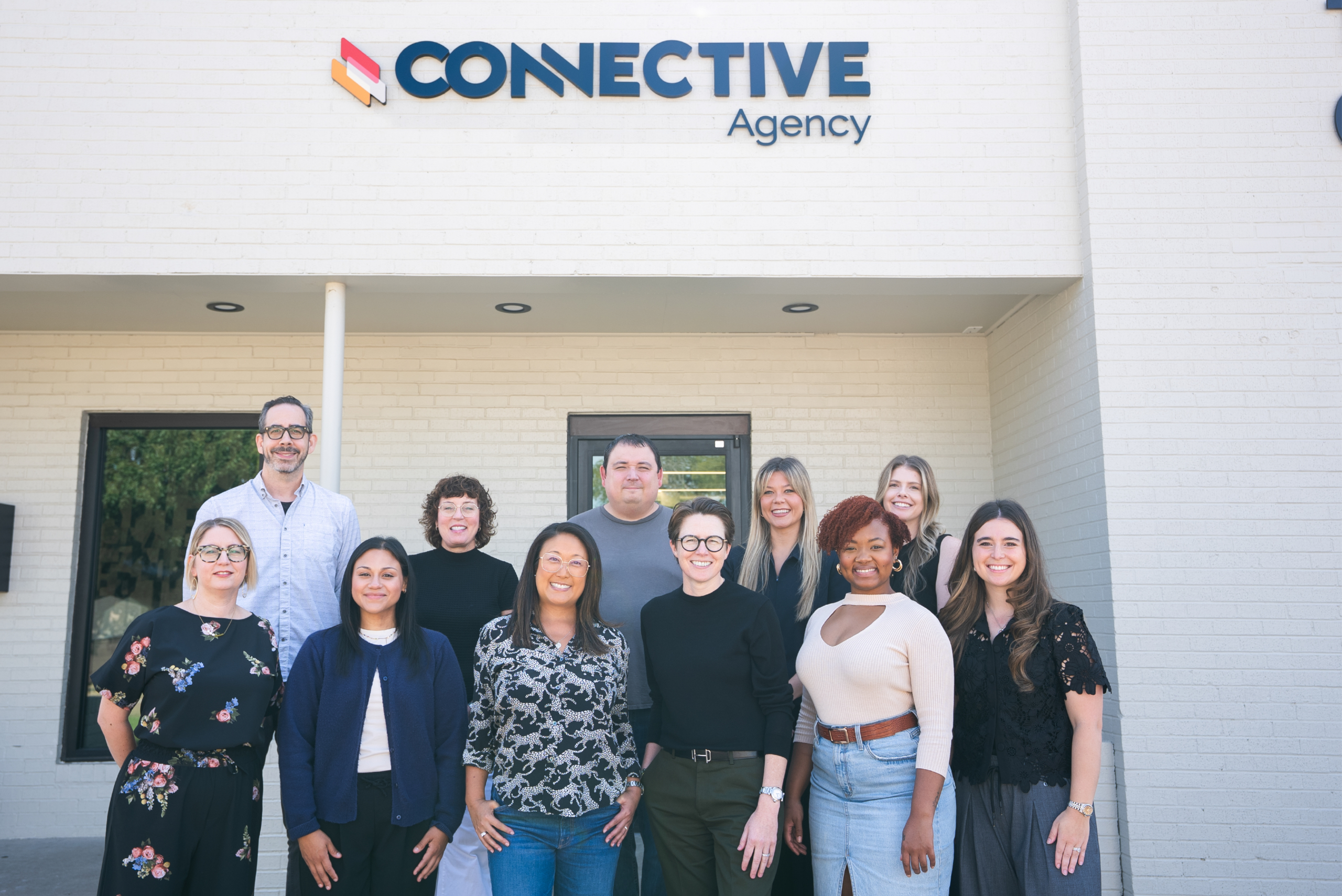 Photo of CONNECTIVE team in front of office